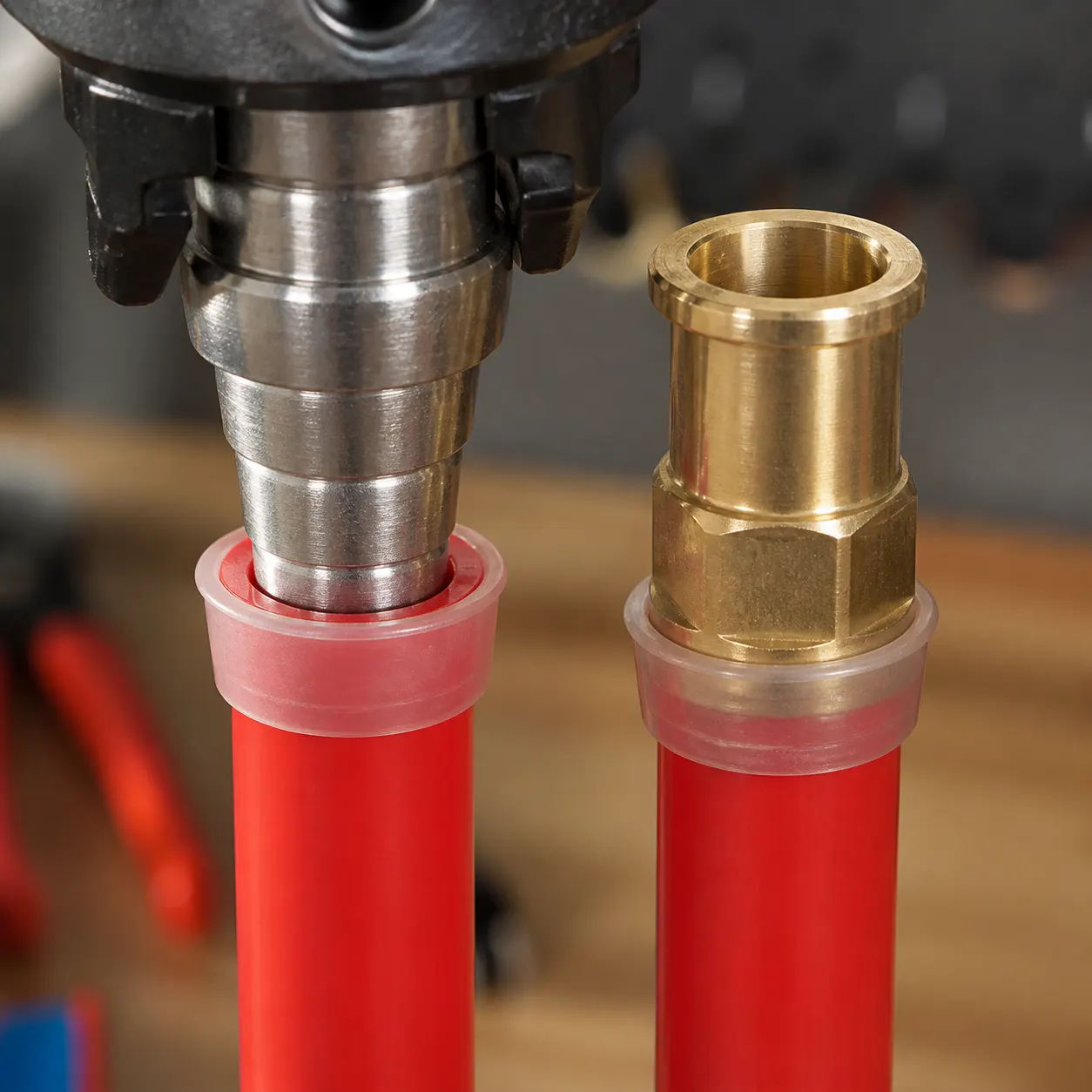 Cold expansion tool expanding a PEX pipe end with a reinforcing ring seated